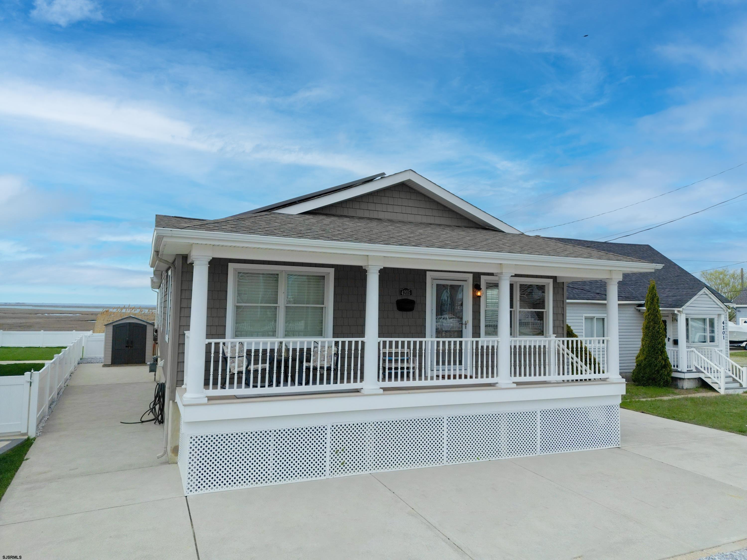 4205 Atlantic Brigantine Boulevard Brigantine, NJ 08203 - Photo 30 of 58 a front view of a house with a large windows