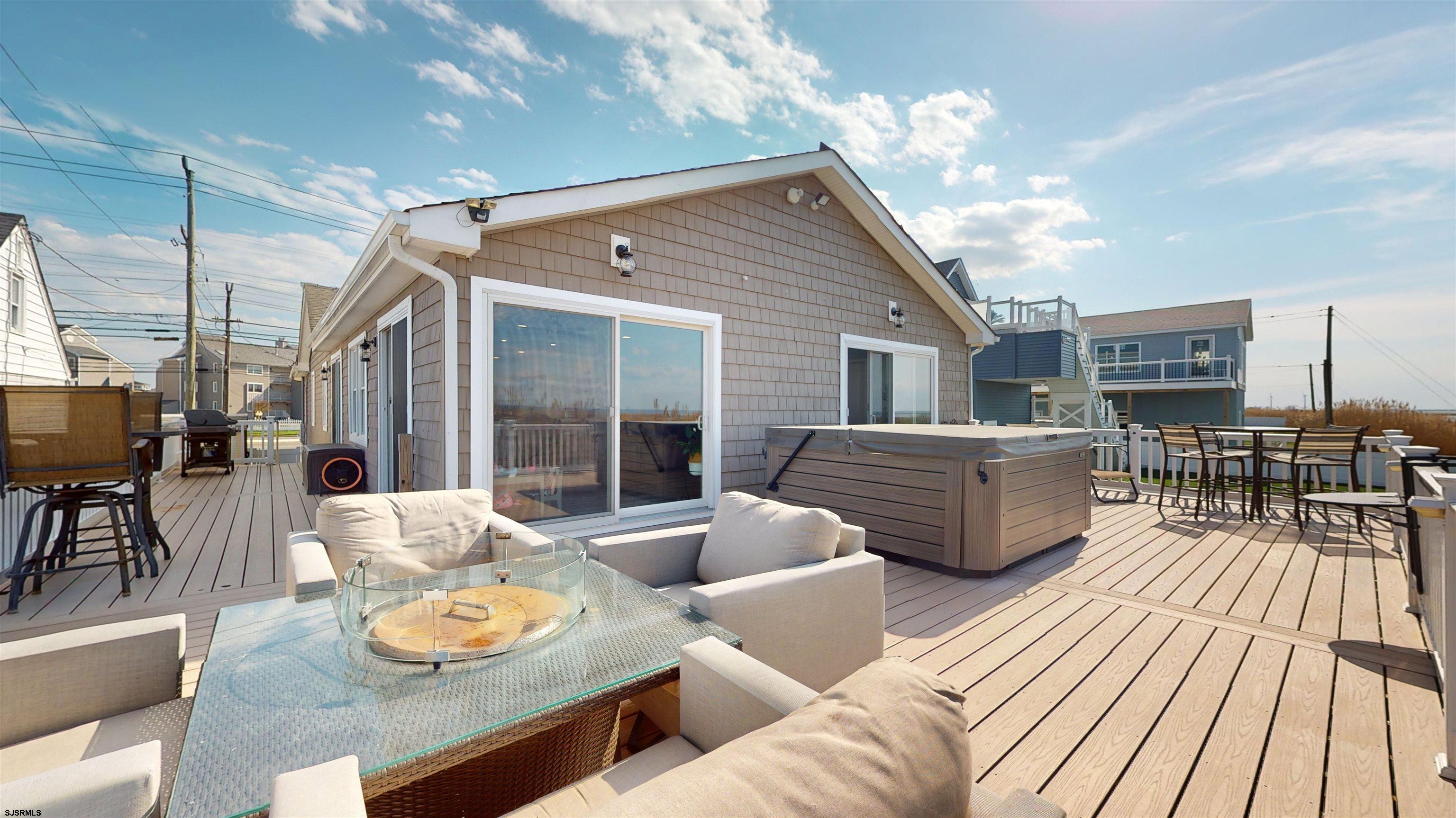 4205 Atlantic Brigantine Boulevard Brigantine, NJ 08203 - Photo 33 of 58 a view of a patio with couches table and chairs