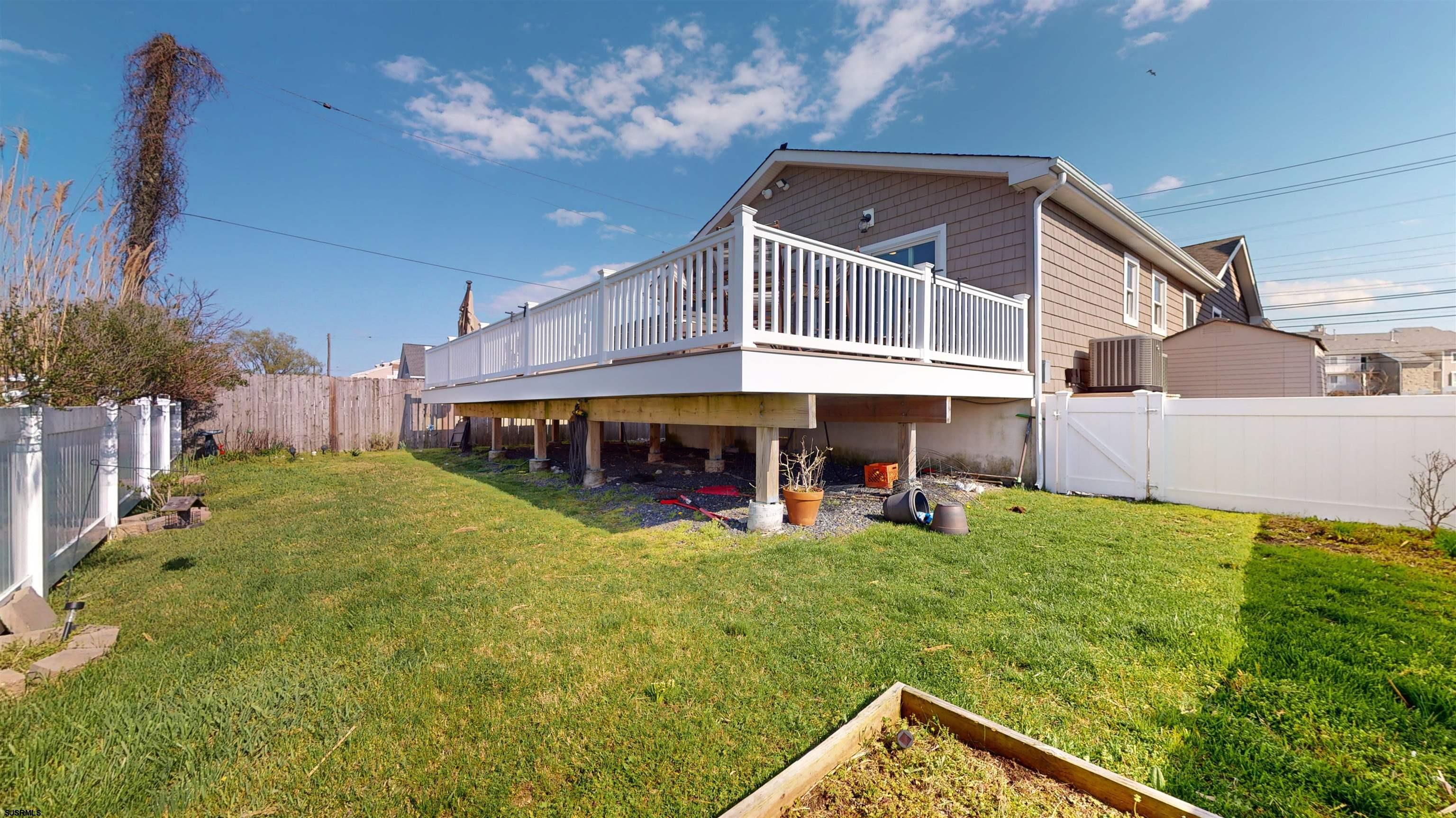 4205 Atlantic Brigantine Boulevard Brigantine, NJ 08203 - Photo 35 of 58 a view of a house with a yard porch and sitting area