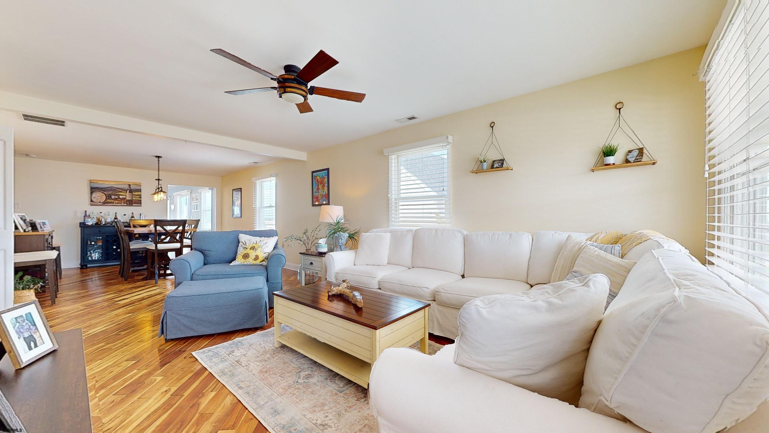 4205 Atlantic Brigantine Boulevard Brigantine, NJ 08203 - Photo 8 of 58 a living room with furniture kitchen view and a large window