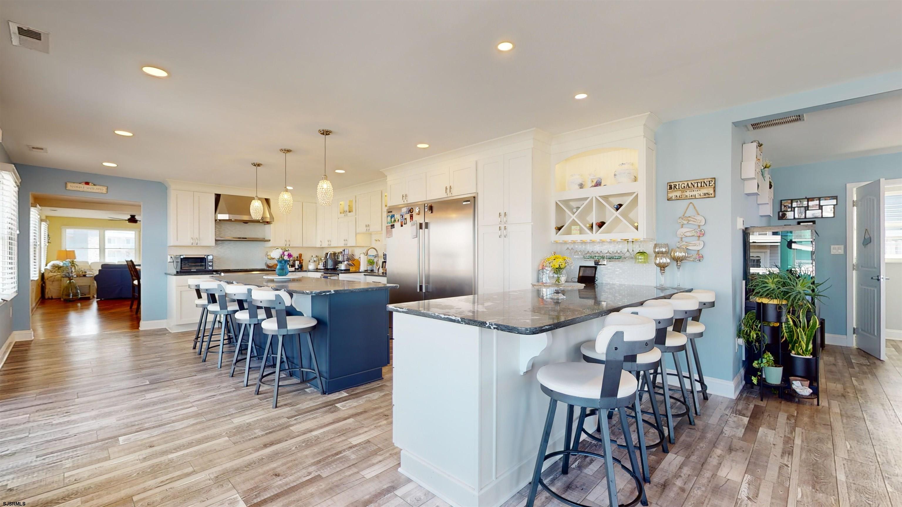 4205 Atlantic Brigantine Boulevard Brigantine, NJ 08203 - Photo 10 of 58 a view of a dining room with furniture and wooden floor
