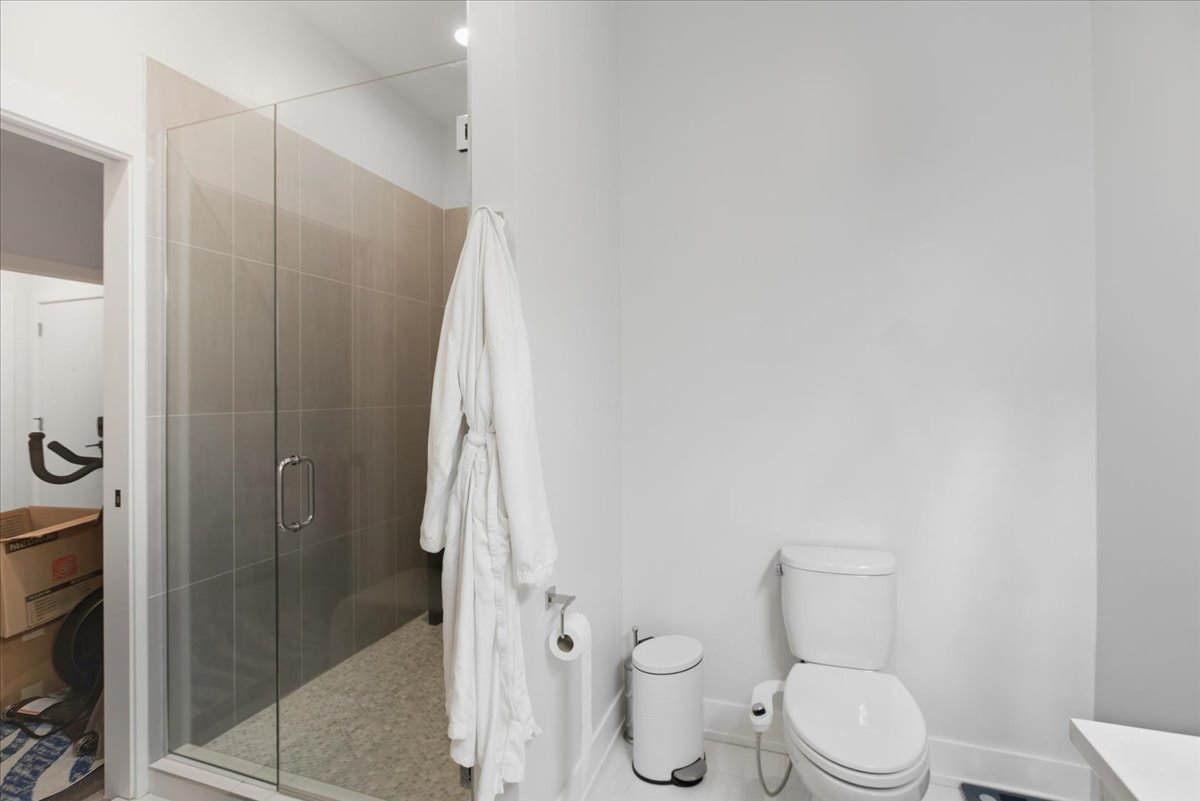 2317 North Clark Street, Unit 410 Chicago, IL 60614 - Photo 9 of 16 a white toilet sitting next to a bathroom sink