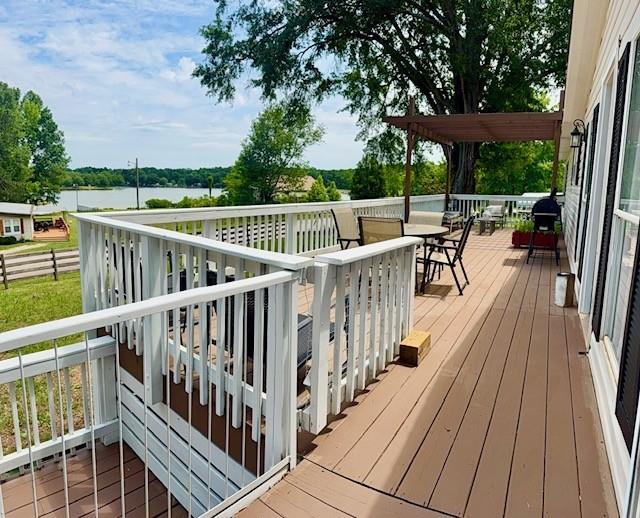 26 Skyland Drive West Locust Grove, GA 30248 - Photo 1 of 29 a view of balcony with outdoor seating and wooden floor
