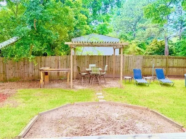 a view of a backyard with swimming pool