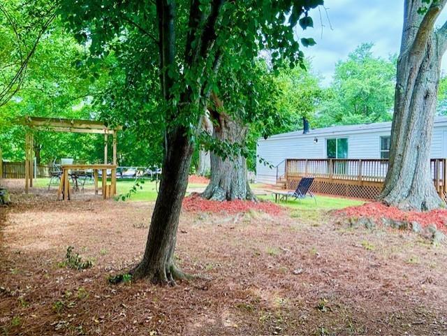 26 Skyland Drive West Locust Grove, GA 30248 - Photo 26 of 29 a house that has a tree in front of it