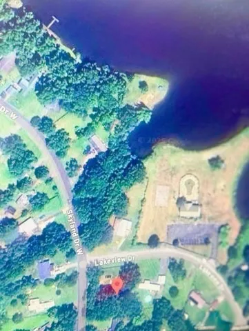 a backyard of a house with a yard and outdoor seating