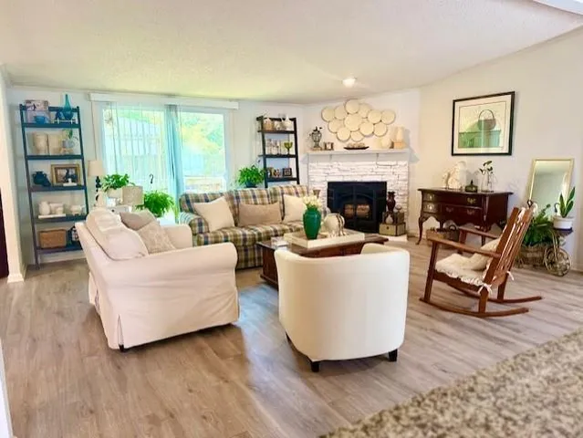 a living room with furniture and a fireplace