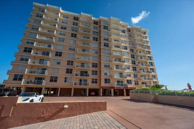 a view of a tall building and a street view