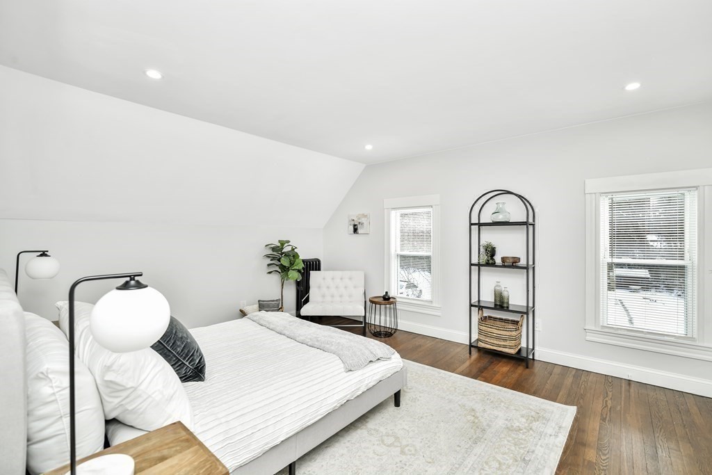 234 Rockland Street Canton, MA 02021 - Photo 17 of 38 a bedroom with a bed and wooden floor