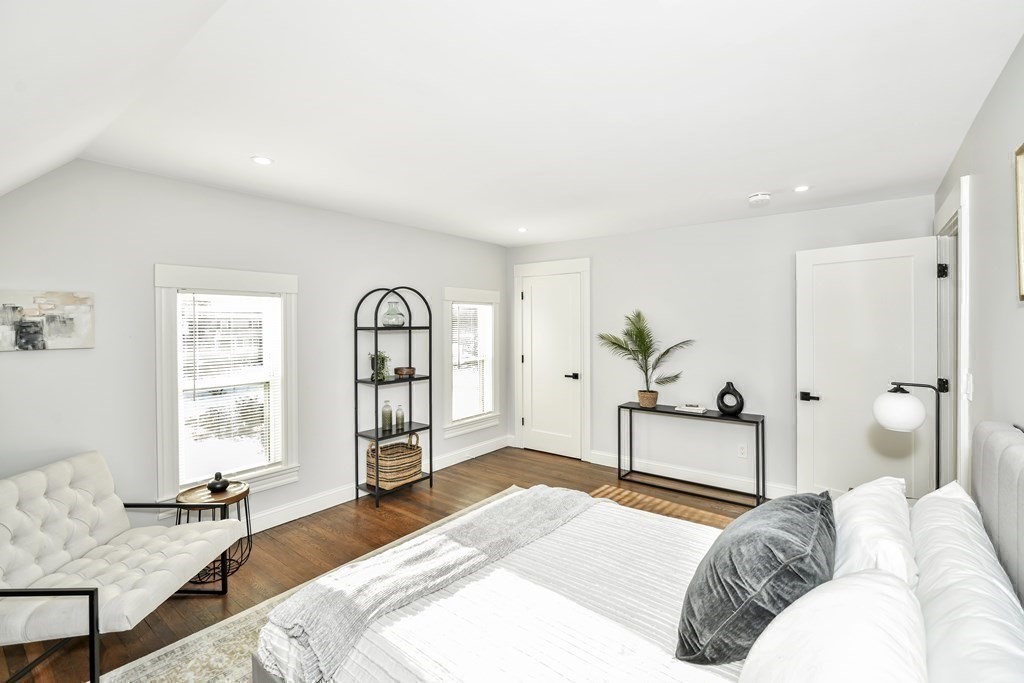 234 Rockland Street Canton, MA 02021 - Photo 20 of 38 a bedroom with a bed and wooden floor