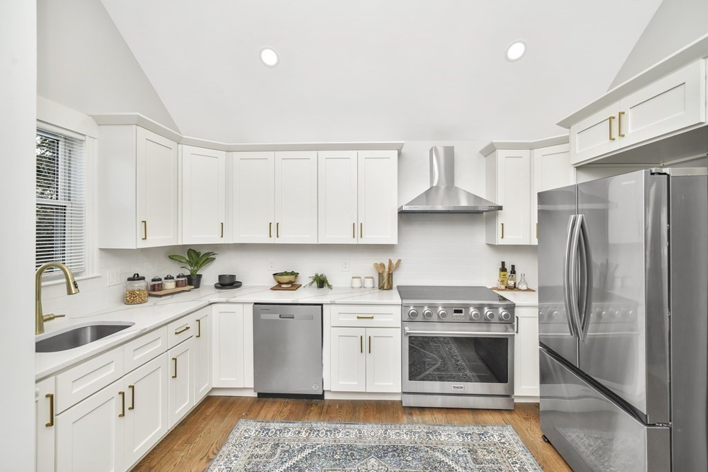 234 Rockland Street Canton, MA 02021 - Photo 2 of 38 a kitchen with a white stove top oven and refrigerator