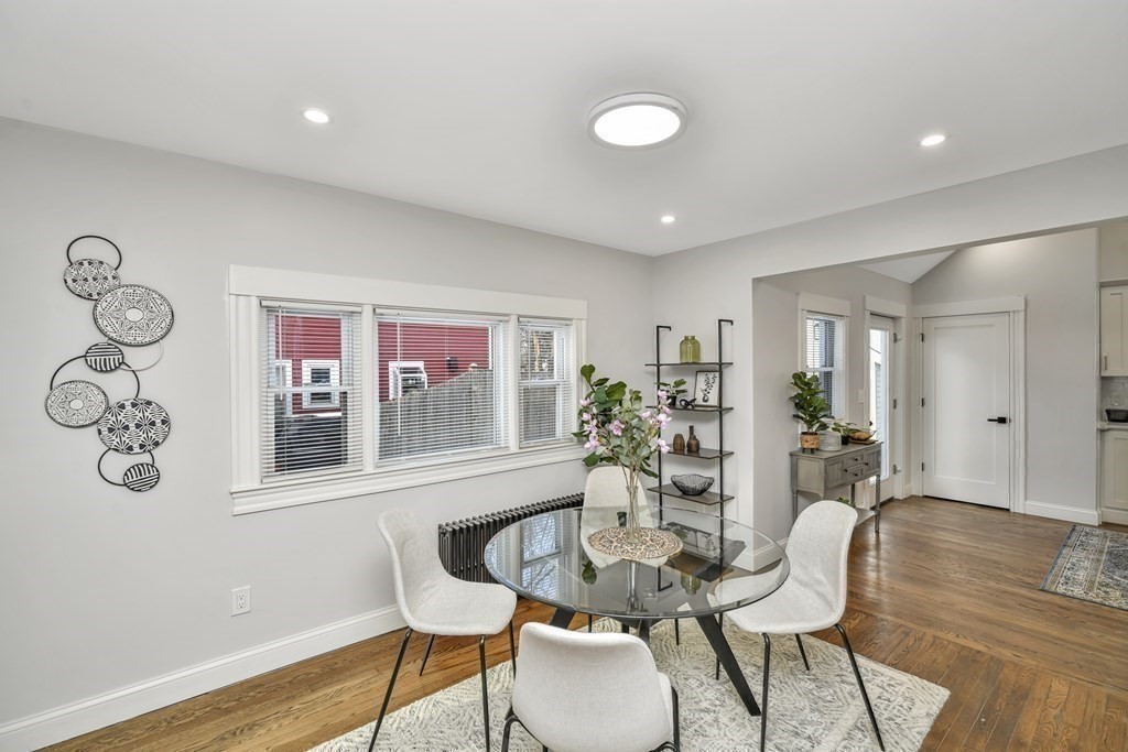 234 Rockland Street Canton, MA 02021 - Photo 32 of 38 a dining room with furniture and wooden floor
