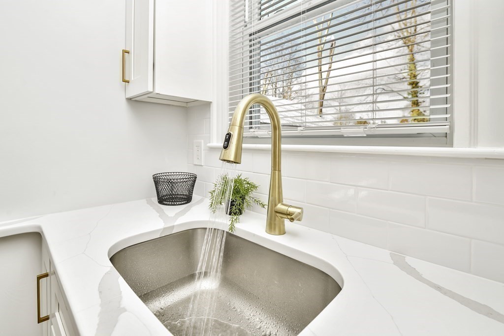 234 Rockland Street Canton, MA 02021 - Photo 5 of 38 a bathroom with a sink a vanity and a window