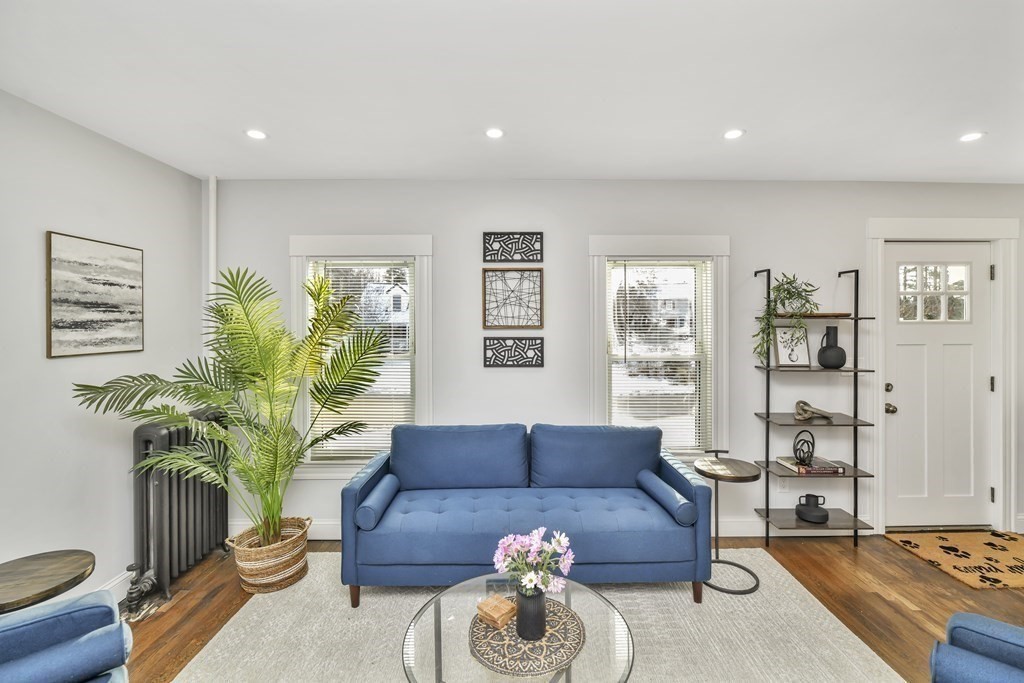 234 Rockland Street Canton, MA 02021 - Photo 10 of 38 a living room with furniture potted plant and a window