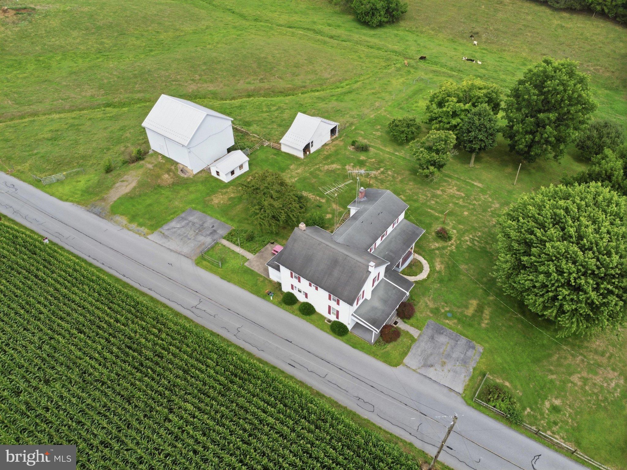 697 Shinham Road Greencastle, PA 17225 - Photo 15 of 23 Aerial of farmhouse and barn w/outbuildings!