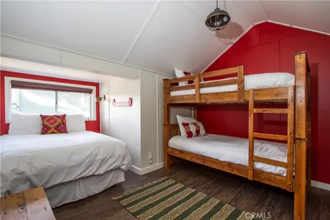 a view of backyard with swimming pool and seating