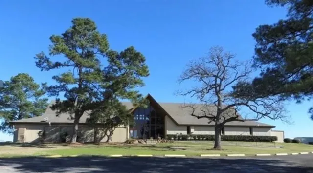 a view of a house with backyard and porch