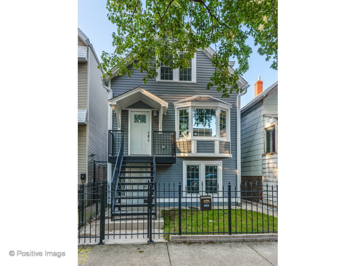 2036 West Melrose Street Chicago, IL 60618 - Photo 1 of 1 a front view of a house with garden