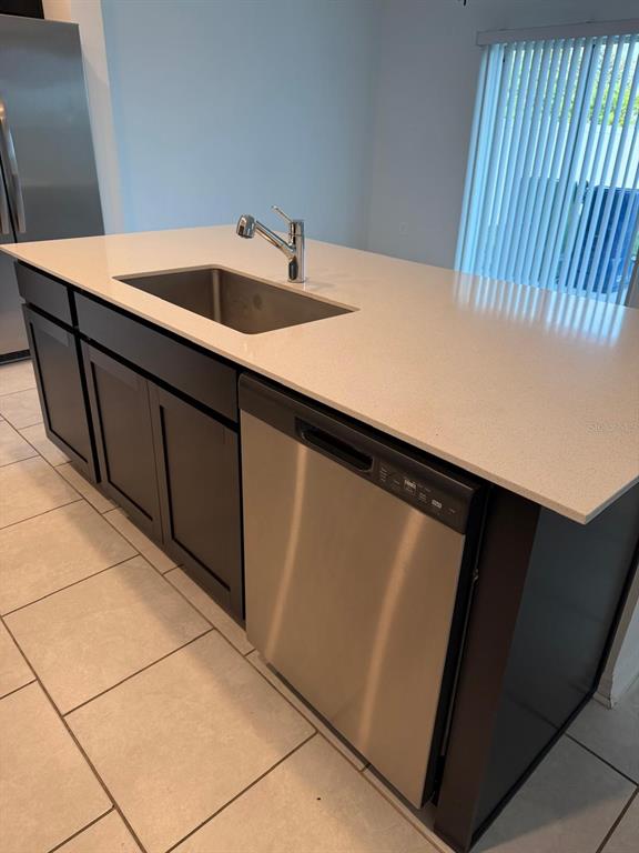 693 Reggie Road Winter Haven, FL 33859 - Photo 7 of 17 a kitchen with a sink and cabinets