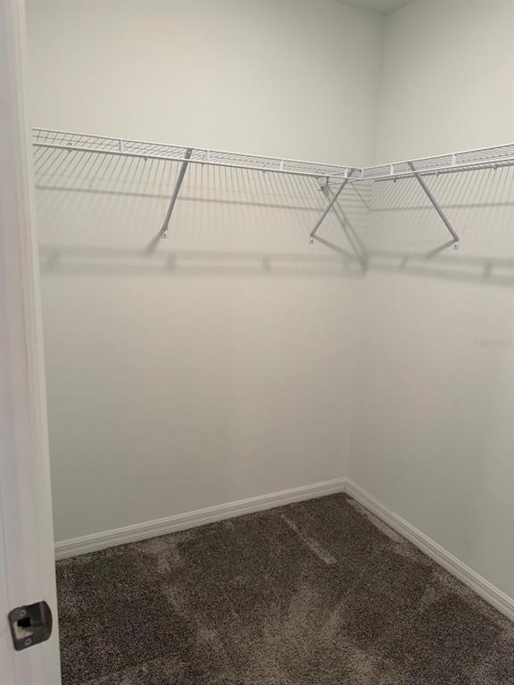 693 Reggie Road Winter Haven, FL 33859 - Photo 10 of 17 a view of a room with racks on the wall