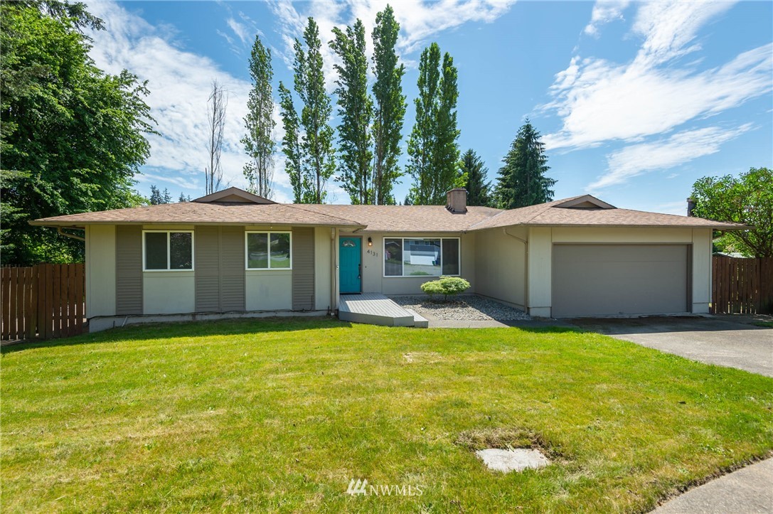 4131 Northeast 19th Street Renton, WA 98059 - Photo 1 of 40 a view of a house with a yard and sitting area