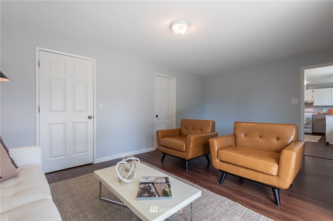 4131 Northeast 19th Street Renton, WA 98059 - Photo 12 of 40 a living room with furniture and a wooden floor