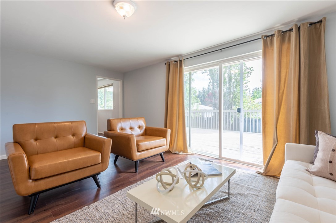 4131 Northeast 19th Street Renton, WA 98059 - Photo 14 of 40 a living room with furniture and a large window
