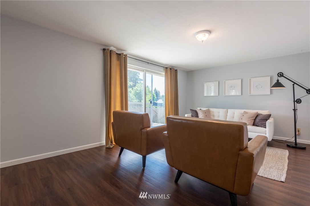 4131 Northeast 19th Street Renton, WA 98059 - Photo 16 of 40 a living room with furniture and a window