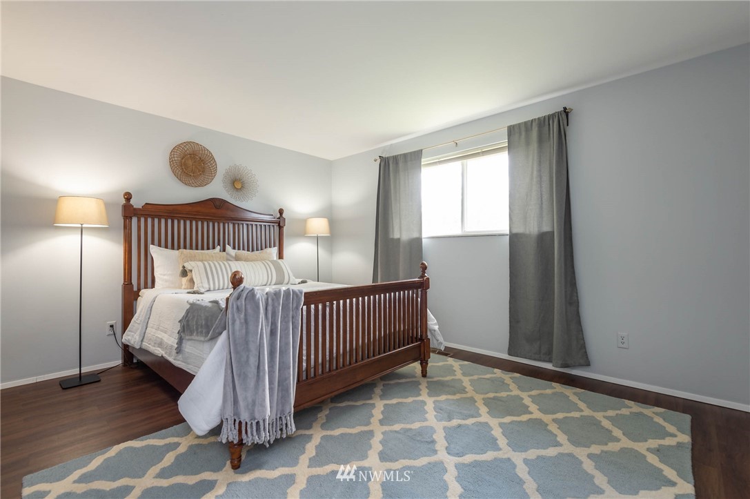 4131 Northeast 19th Street Renton, WA 98059 - Photo 19 of 40 a bedroom with a bed and a window