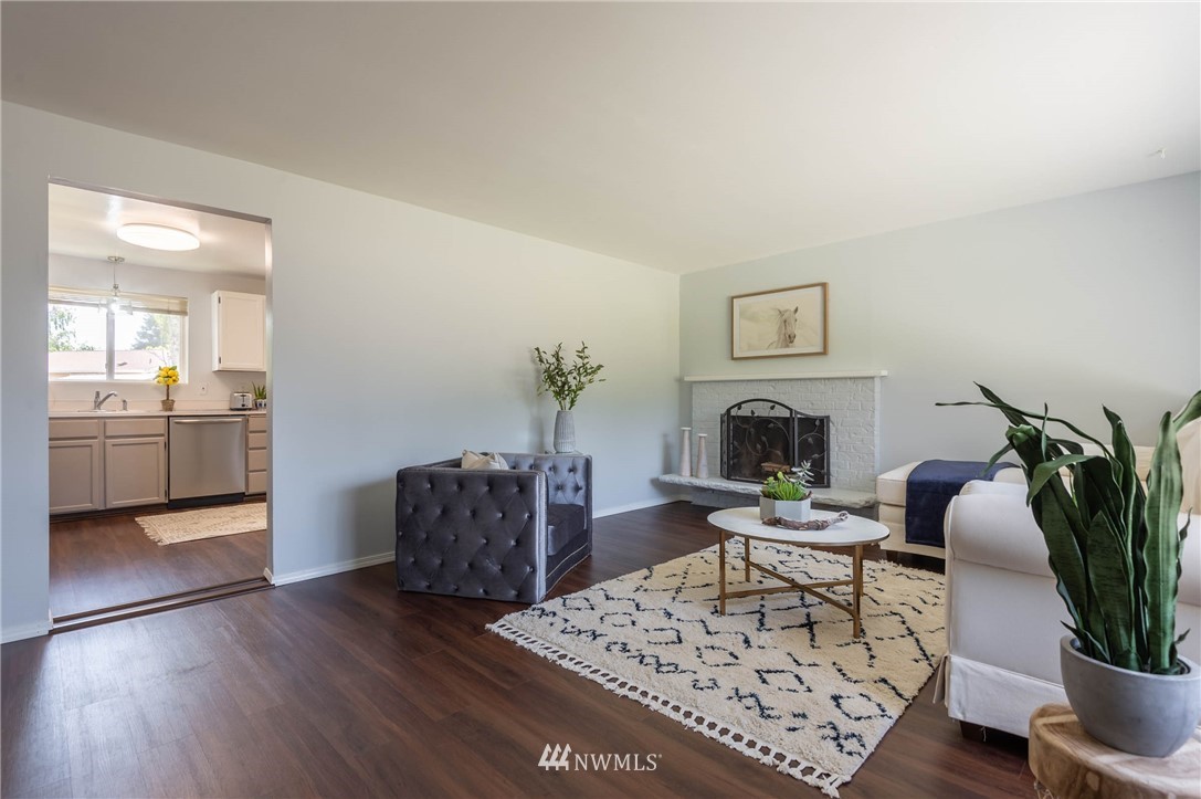 4131 Northeast 19th Street Renton, WA 98059 - Photo 3 of 40 a living room with furniture a potted plant and kitchen view