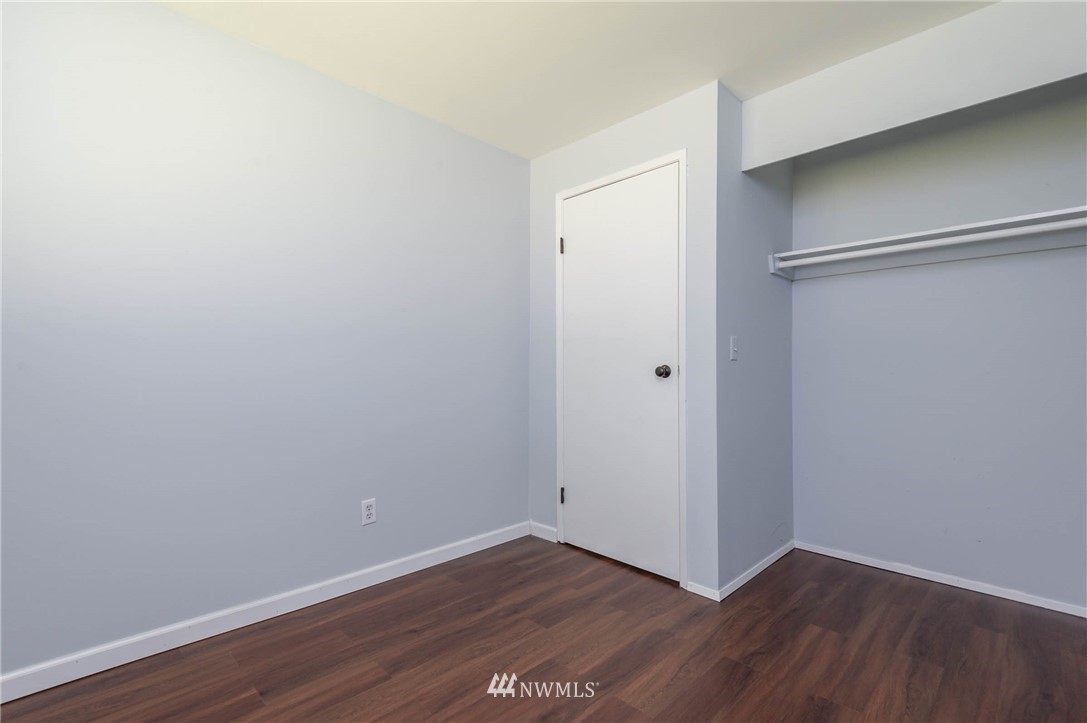 4131 Northeast 19th Street Renton, WA 98059 - Photo 26 of 40 a view of an empty room with wooden floor