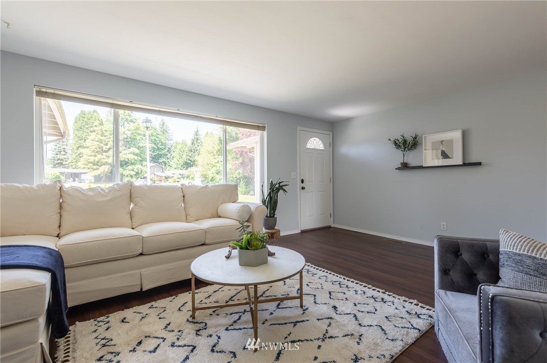 4131 Northeast 19th Street Renton, WA 98059 - Photo 4 of 40 a living room with furniture and a wooden floor