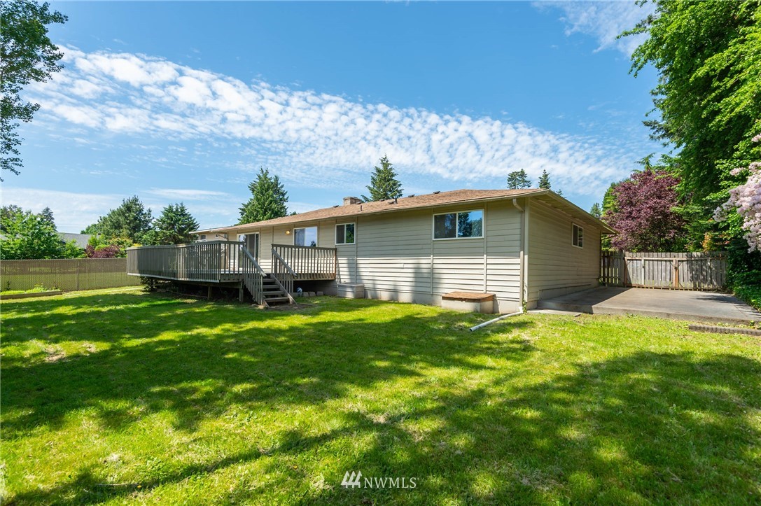 4131 Northeast 19th Street Renton, WA 98059 - Photo 31 of 40 a front view of house with yard and trees