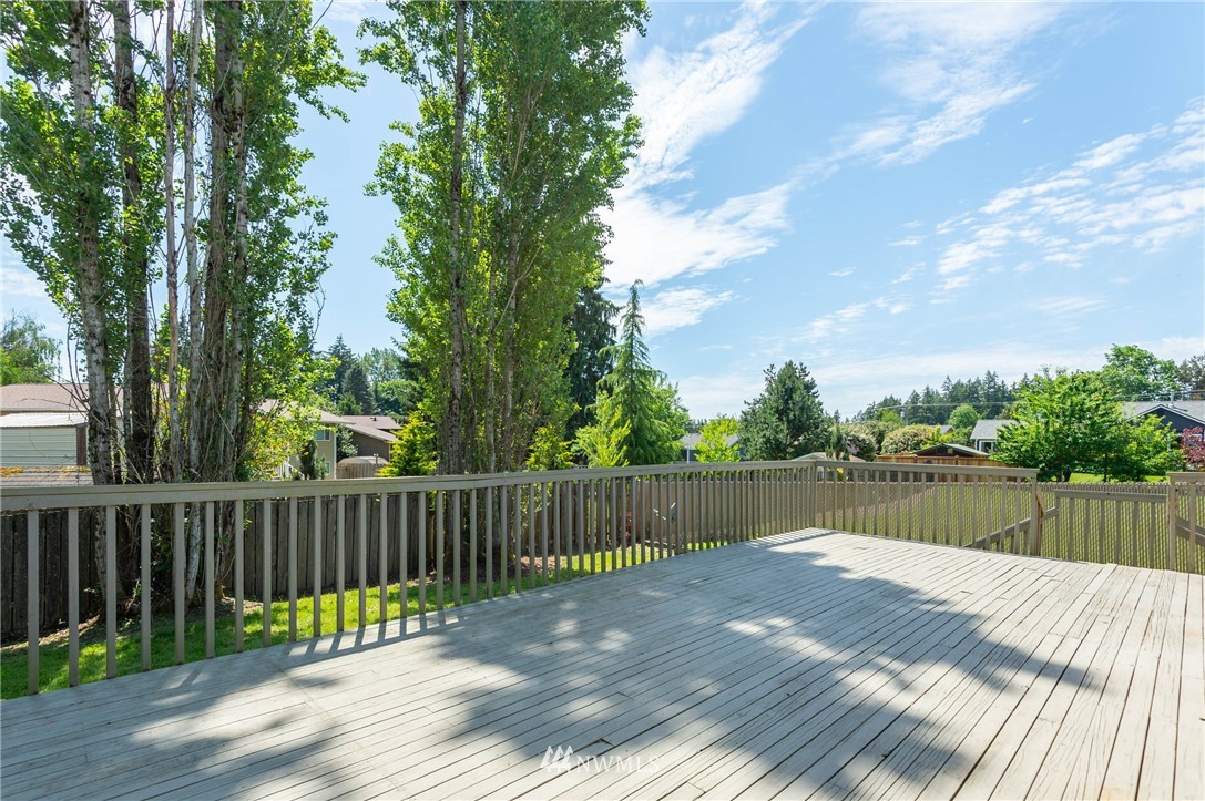 4131 Northeast 19th Street Renton, WA 98059 - Photo 36 of 40 a view of a wooden deck with lake view