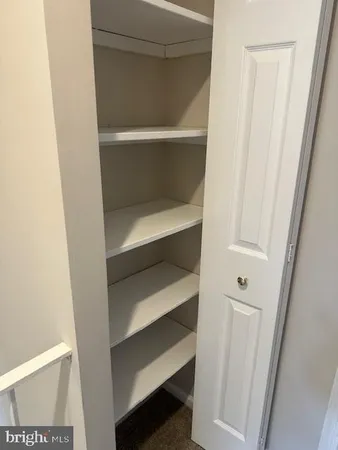a bathroom with a double vanity sink toilet and mirror