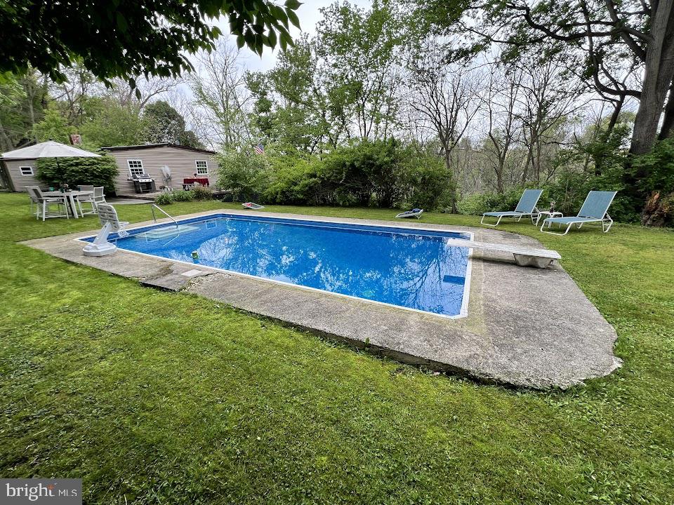 3059 Back Run Road Manheim, PA 17545 - Photo 12 of 19 a view of swimming pool with lawn chairs and large trees