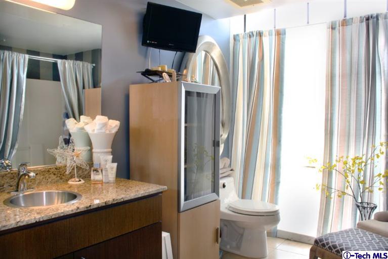 200 North San Fernando Road, Unit 314 Lincoln Heights, CA 90031 - Photo 15 of 28 a bathroom with a double vanity sink and a mirror