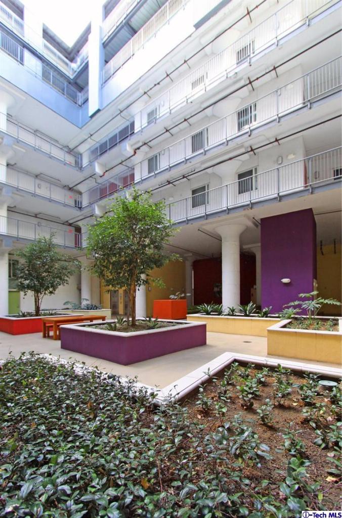 200 North San Fernando Road, Unit 314 Lincoln Heights, CA 90031 - Photo 18 of 28 a building with trees in front of it