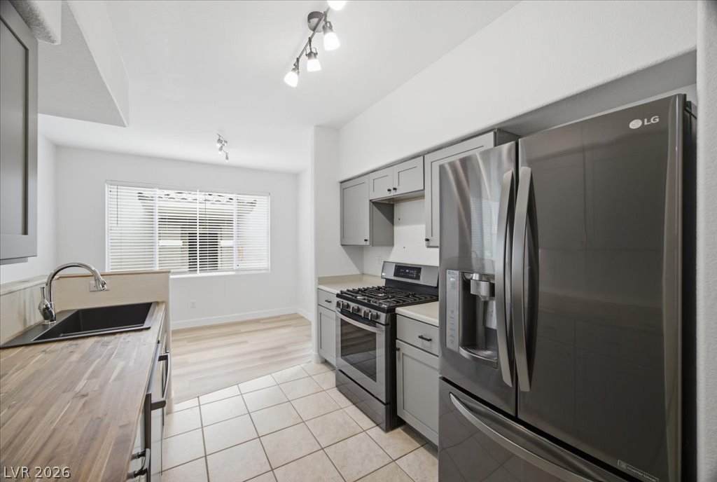 9050 West Warm Springs Road, Unit 1033 Las Vegas, NV 89148 - Photo 4 of 26 Culinary delights await in this bright kitchen, complete with modern appliances and ample counter space.