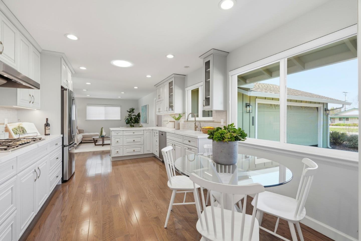 1380 Ridgeley Drive Campbell, CA 95008 - Photo 11 of 39 a view of a dining room with furniture a potted plant and wooden floor