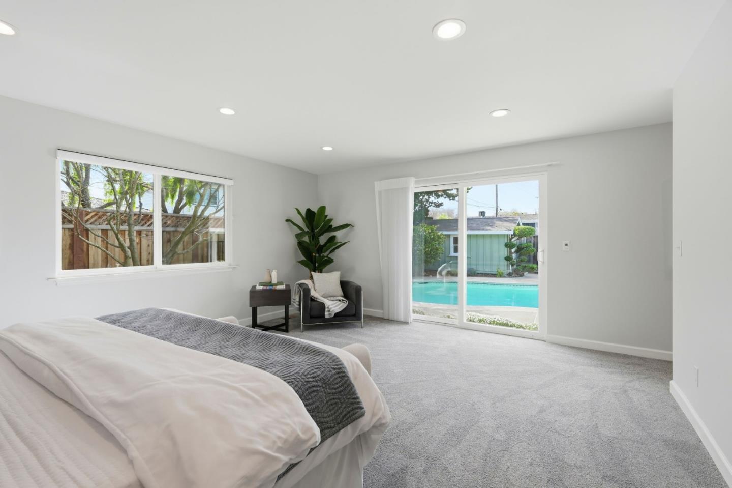 1380 Ridgeley Drive Campbell, CA 95008 - Photo 17 of 39 a spacious bedroom with a large bed and a large window