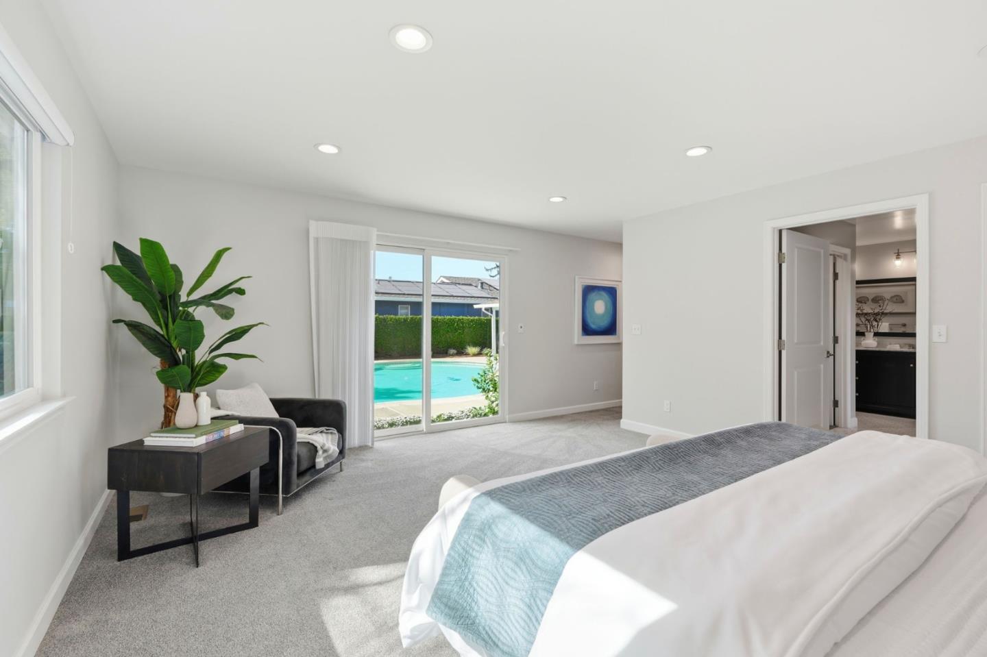1380 Ridgeley Drive Campbell, CA 95008 - Photo 18 of 39 a spacious bedroom with a large bed and a potted plant