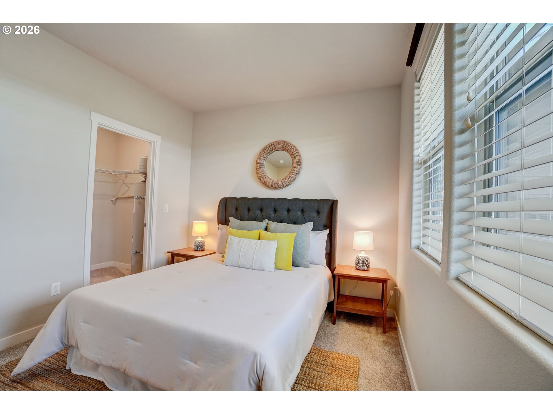 16417 Northwest Chadwick Way, Unit 302 Portland, OR 97229 - Photo 11 of 20 a bedroom with a bed and a window