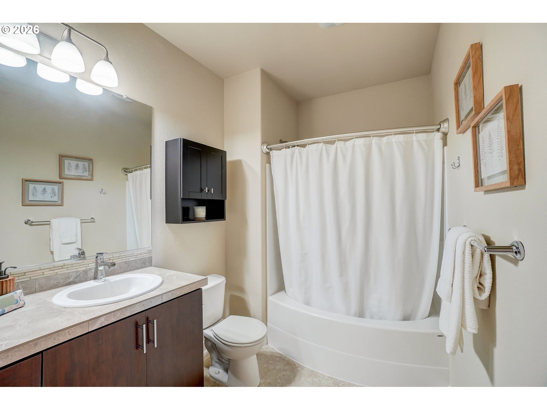 16417 Northwest Chadwick Way, Unit 302 Portland, OR 97229 - Photo 12 of 20 a bathroom with a sink vanity granite and toilet