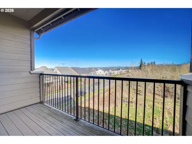 a view of balcony with wooden floor