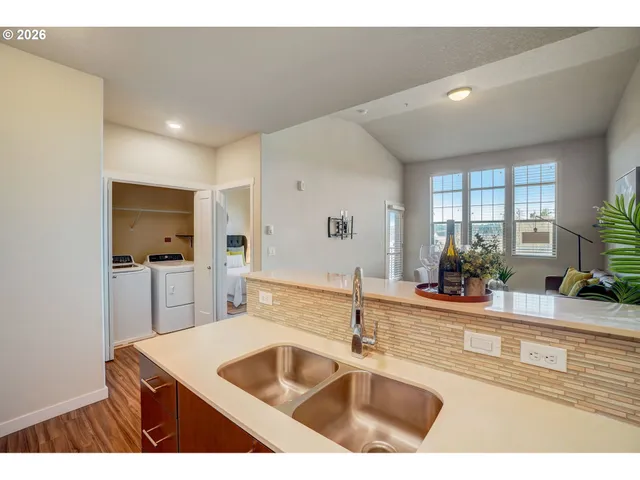 a kitchen with a sink and a refrigerator