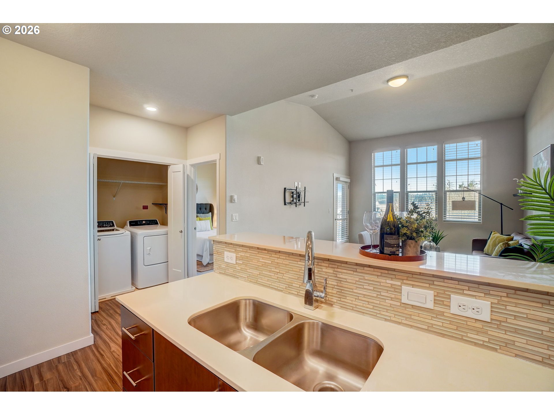 16417 Northwest Chadwick Way, Unit 302 Portland, OR 97229 - Photo 9 of 20 a kitchen with a sink and a refrigerator