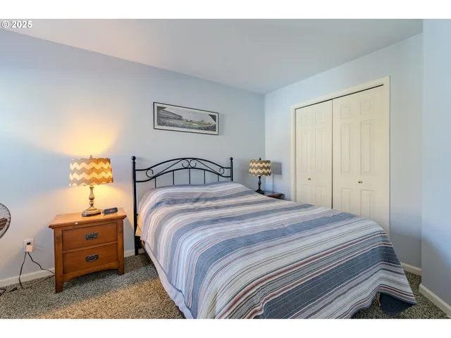 a bedroom with a bed and a closet