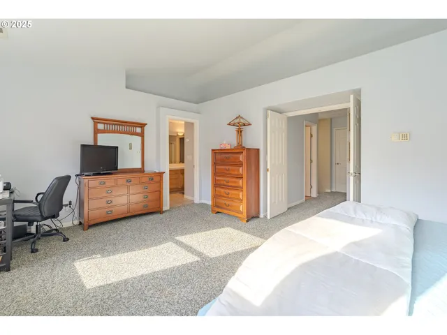 a bedroom with a bed and furniture