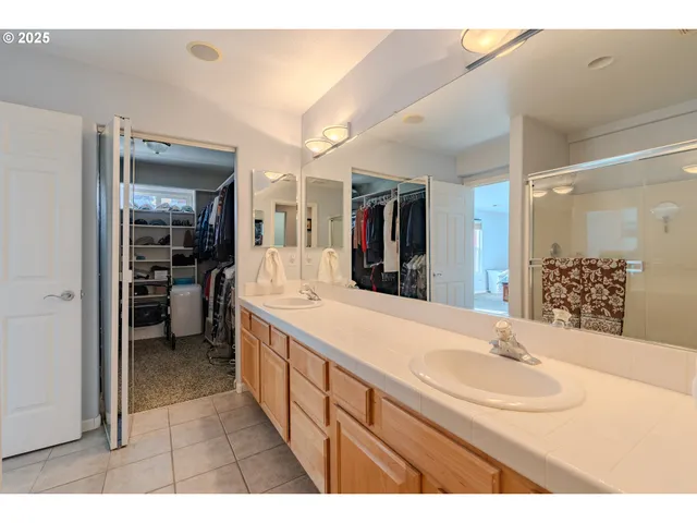 a bathroom with a sink a mirror and a bathtub